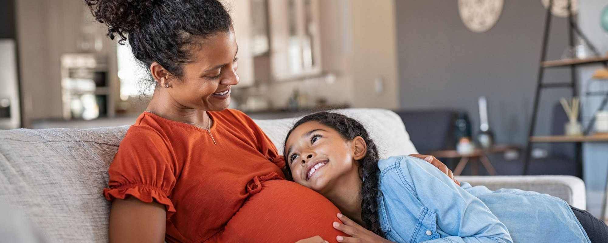 Pregnant mom with her daughter