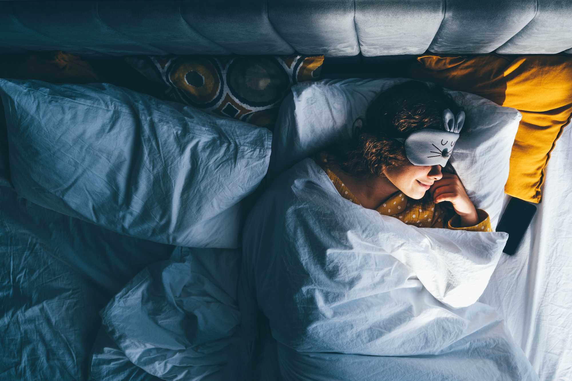 Woman sleeping with an eye mask on